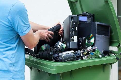 Residential and commercial waste being loaded into a skip