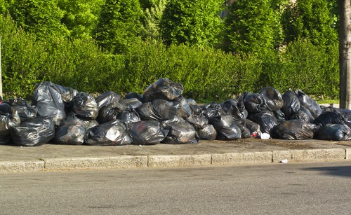 Transfer station sorting recyclables from skips in central London