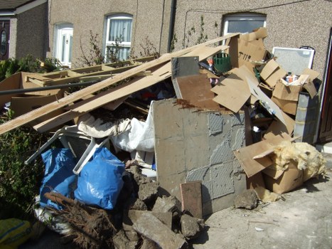 Professional team assisting with skip placement